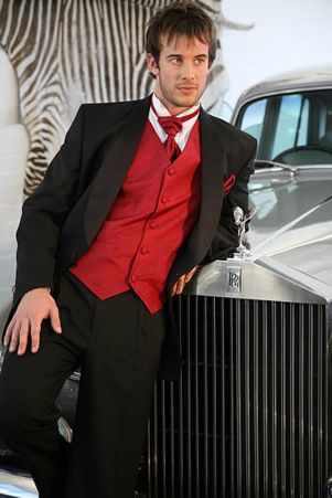 Black tux with red accessories